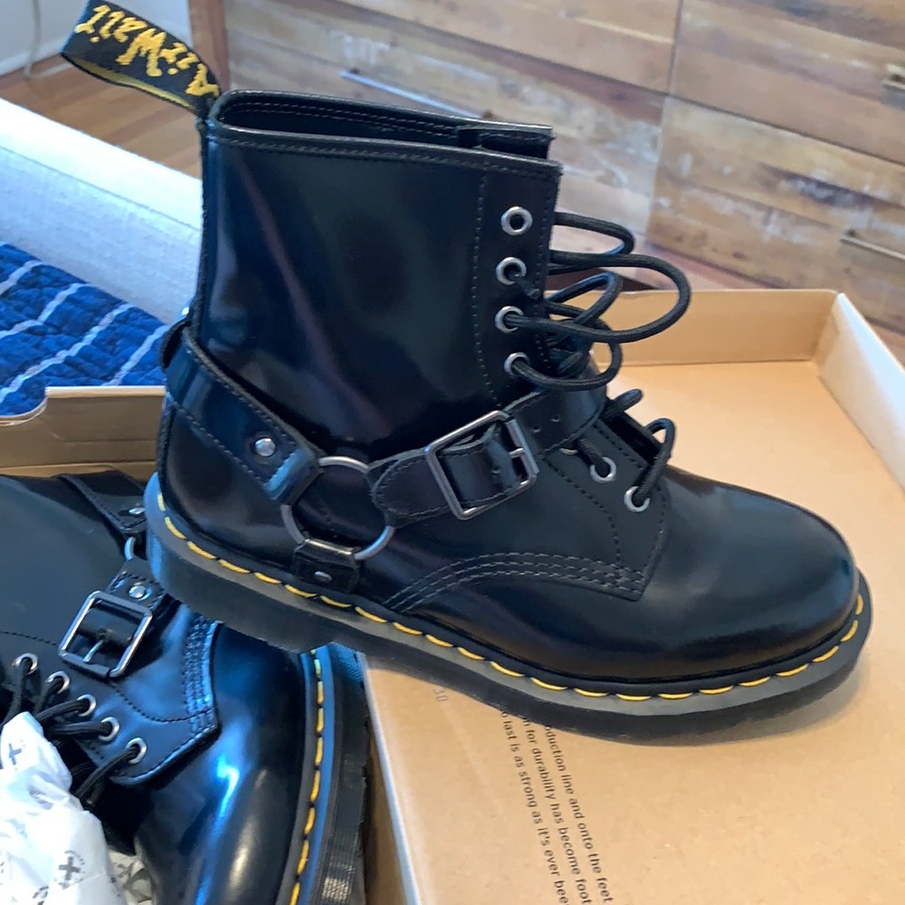Black polished smooth Dr. Martens boots.